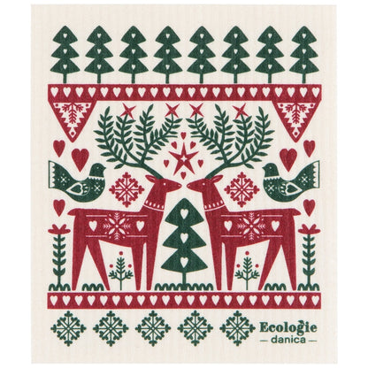 A white swedish dishcloth featuring a Christmas-themed pattern with red reindeer, green trees, birds, hearts, and snowflakes on it. The text 'Ecologie - danica' appears in the lower right corner.