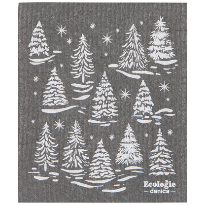 A dark gray swedish dishcloth featuring a white printed pattern of pine trees in a snowy landscape with stars. The brand name 'Ecologie - danica' is printed in white in the bottom right corner.
