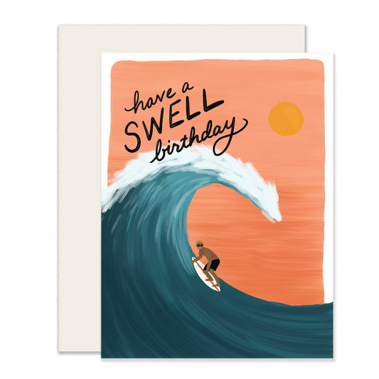 Greeting card with a surfer on a wave and 'have a swell birthday' text against an orange background.