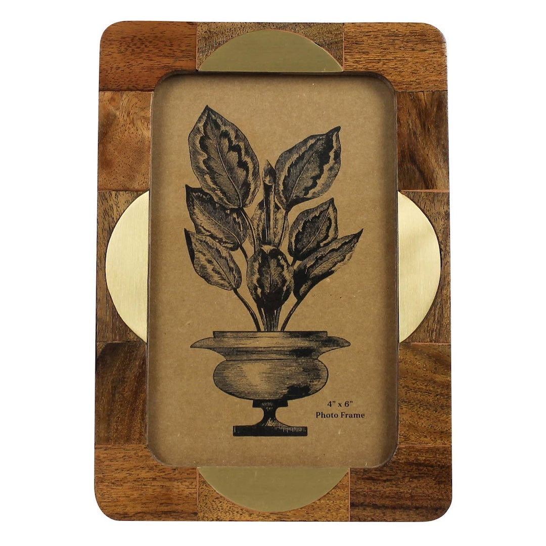 Wooden photo frame with a botanical design on a white background