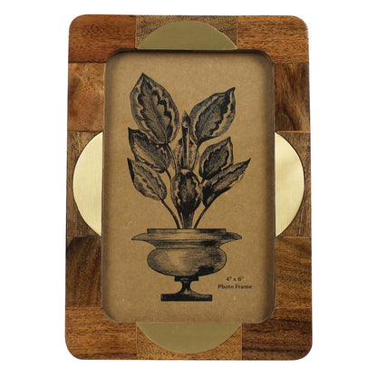 Wooden photo frame with a botanical design on a white background