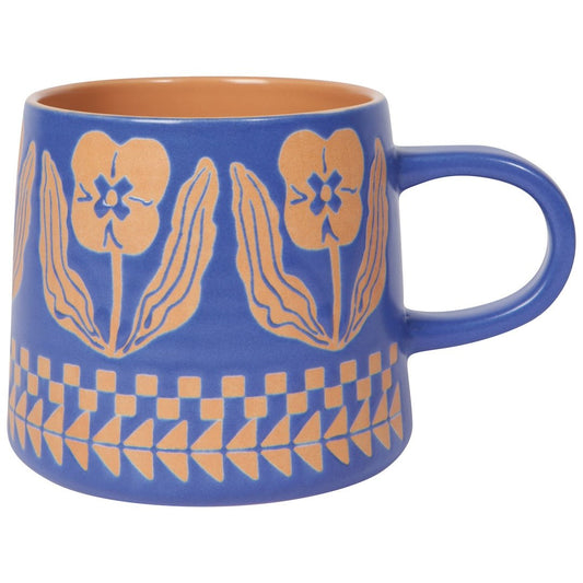 purple mug with orange floral patterns on a white background