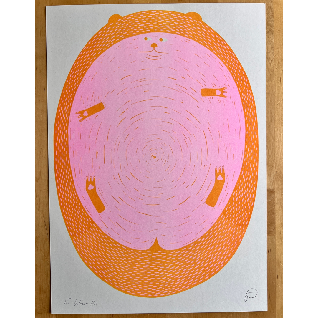 A square art print featuring a stylized pig with an orange border, photographed flat against a light wood background.