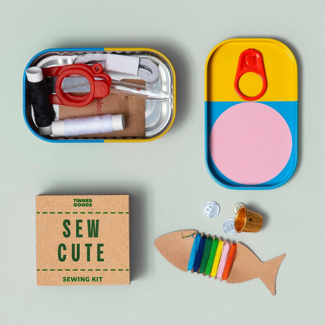 Sew Cute sewing kit with colorful components on a light gray background