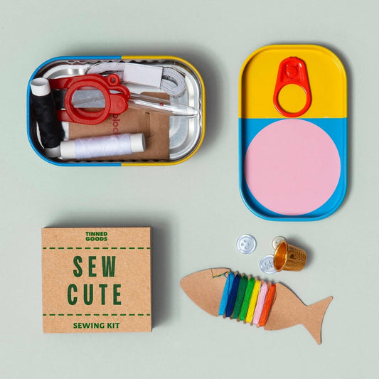 Sew Cute sewing kit with colorful components on a light gray background