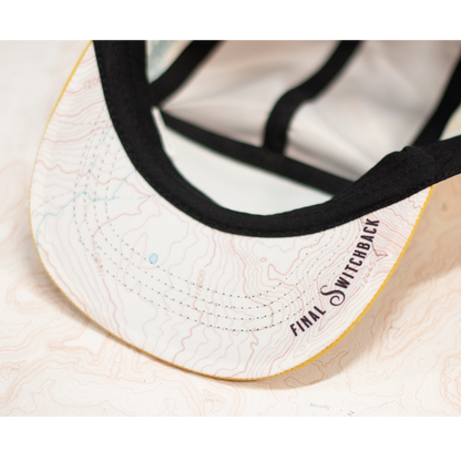 Under side of the cap visor with a topographical map pattern and Final Switchback branding