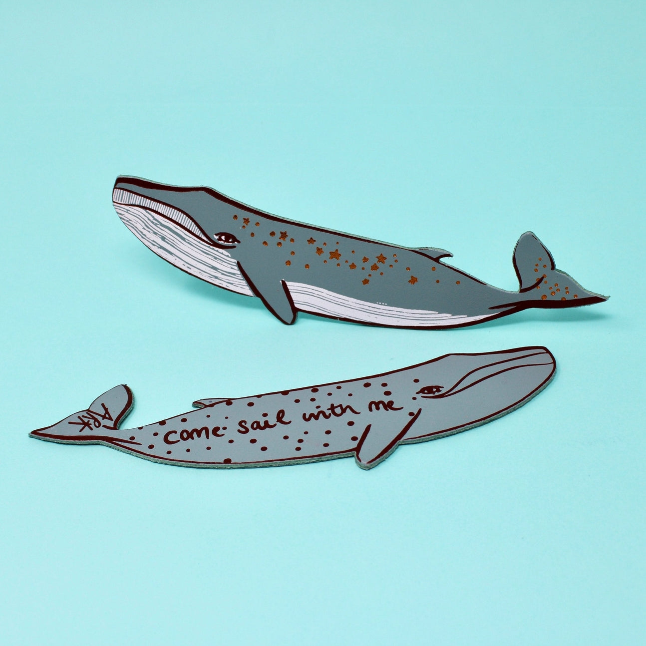 Double sided whale bookmark. One side has "come sail with me" written on it