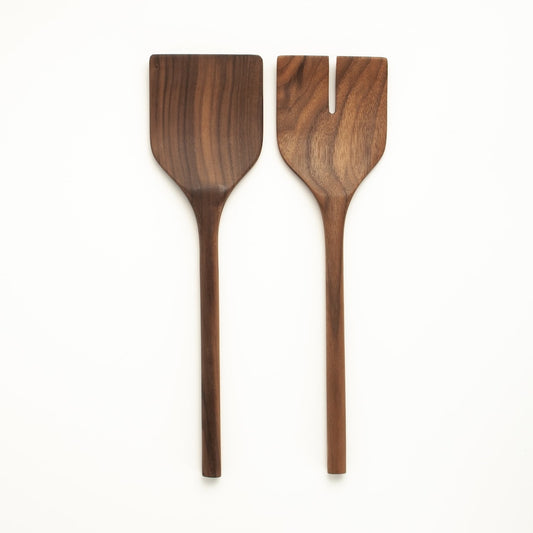 Set of wooden salad servers on a white background