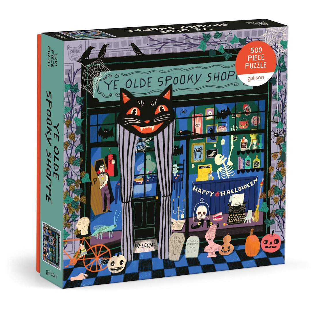 Puzzle box with a Halloween-themed design featuring a black cat and shop window.
