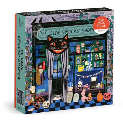 Puzzle box with a Halloween-themed design featuring a black cat and shop window.