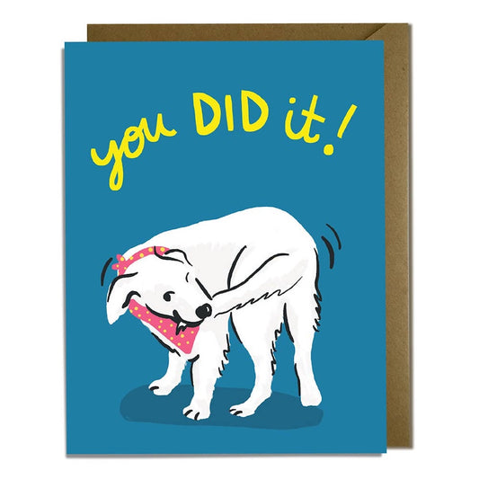 greeting card with a dog grabbing its own tail and text that reads "you did it!"