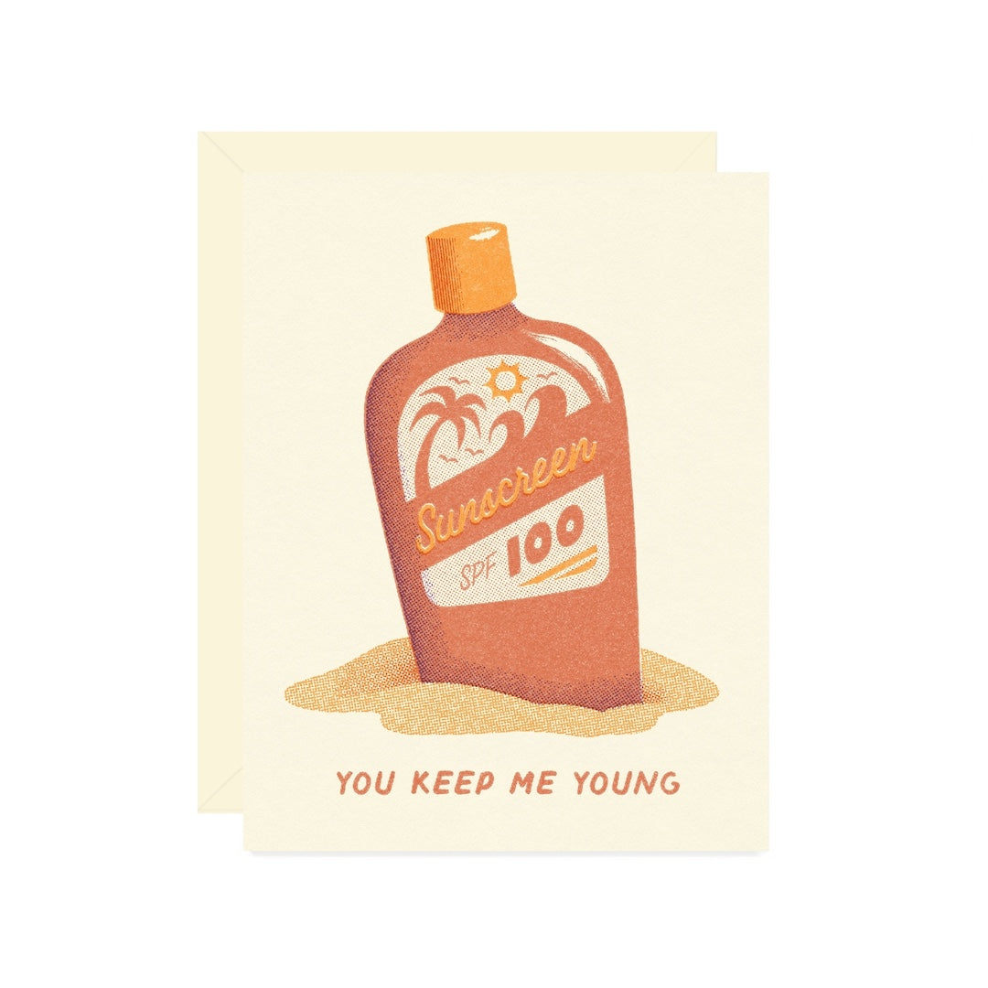 Card featuring an illustration of a sunscreen bottle with 'You Keep Me Young' text on a beige background